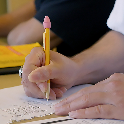 Patient writing in class.